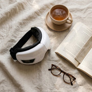 Heated Eye Massager - flat lay with tea