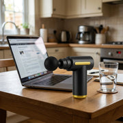 Mini Massage Gun - kitchen table